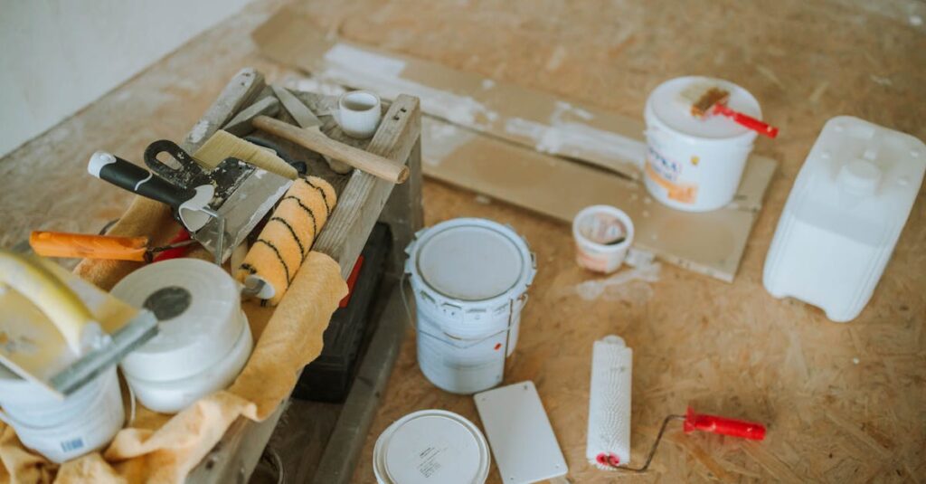 Overhead shot of tools and paint supplies for a home renovation project.
